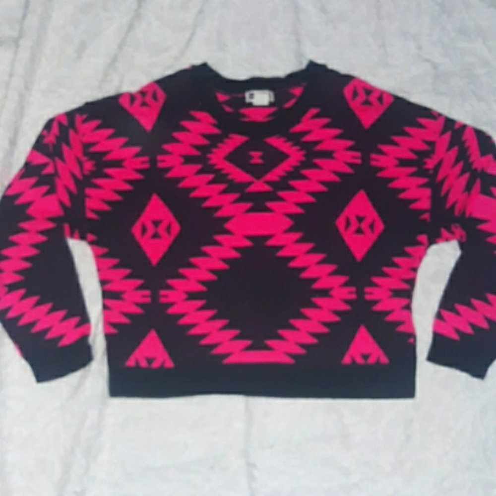 Pink and black geometric sweater